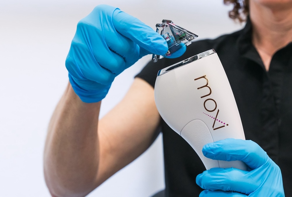 Med spa provider places applicator tip on top of a laser as part of a hyperpigmentation treatment in San Antonio